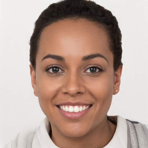 Joyful white young-adult female with short  black hair and brown eyes