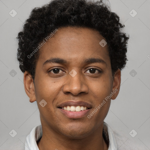 Joyful black young-adult male with short  brown hair and brown eyes