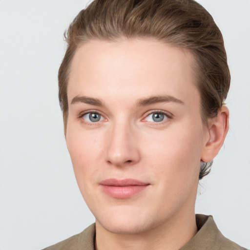 Joyful white young-adult female with short  brown hair and grey eyes