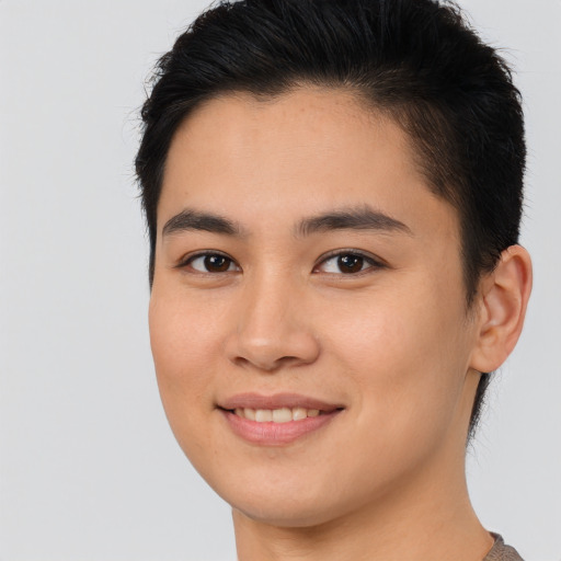 Joyful asian young-adult female with short  brown hair and brown eyes