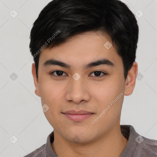 Joyful asian young-adult male with short  black hair and brown eyes