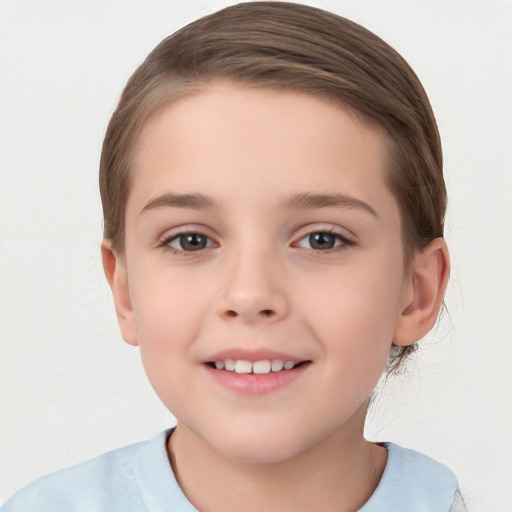 Joyful white child female with short  brown hair and brown eyes