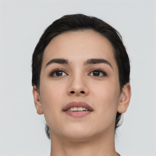 Joyful white young-adult female with short  black hair and brown eyes