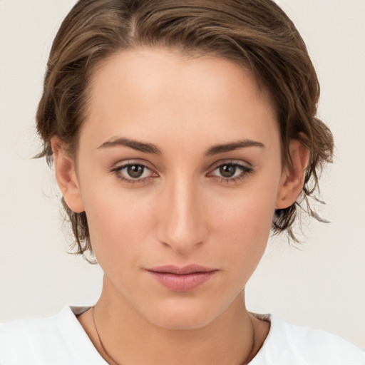 Neutral white young-adult female with medium  brown hair and brown eyes