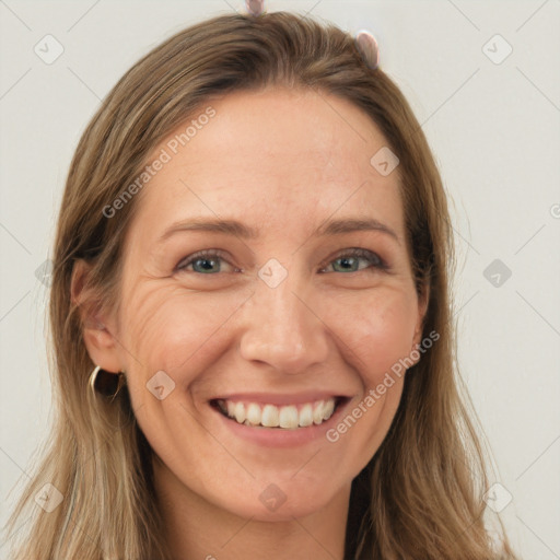 Joyful white young-adult female with long  brown hair and grey eyes