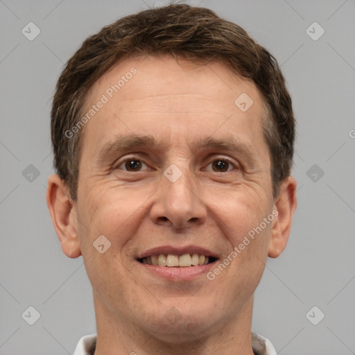 Joyful white adult male with short  brown hair and brown eyes