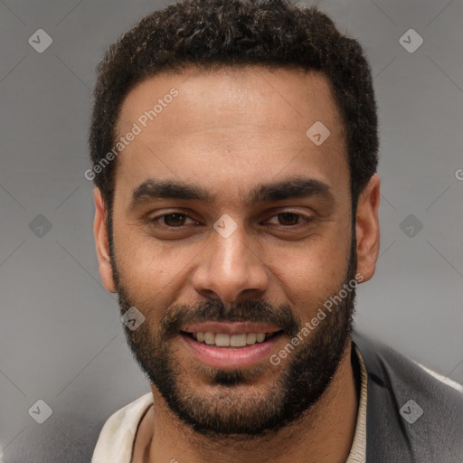 Joyful white young-adult male with short  black hair and brown eyes