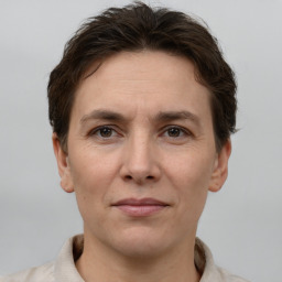 Joyful white adult female with short  brown hair and brown eyes