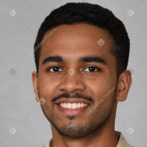 Joyful black young-adult male with short  black hair and brown eyes