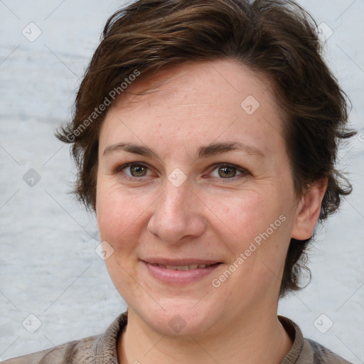 Joyful white adult female with short  brown hair and grey eyes