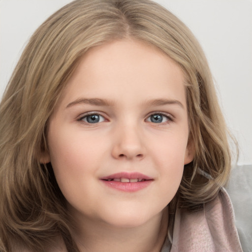 Joyful white child female with long  brown hair and grey eyes