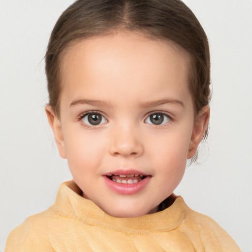 Joyful white child female with short  brown hair and brown eyes