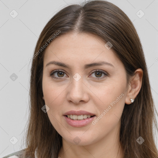 Joyful white young-adult female with long  brown hair and brown eyes