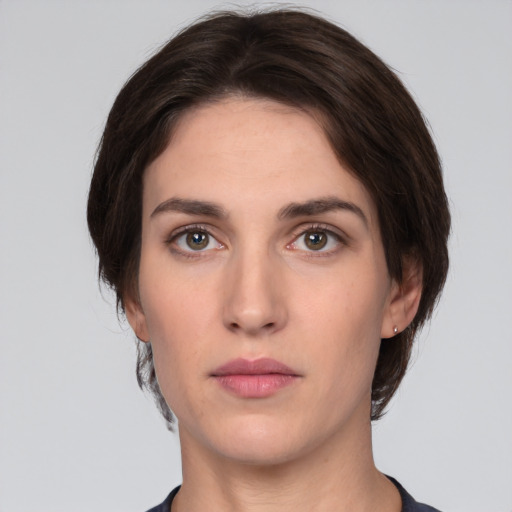 Neutral white young-adult female with short  brown hair and brown eyes