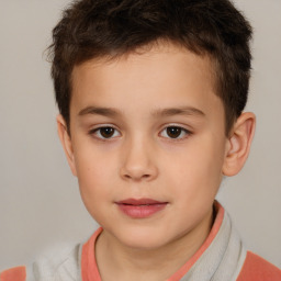 Joyful white child male with short  brown hair and brown eyes