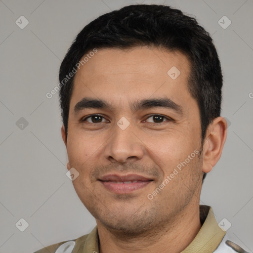 Joyful latino young-adult male with short  black hair and brown eyes