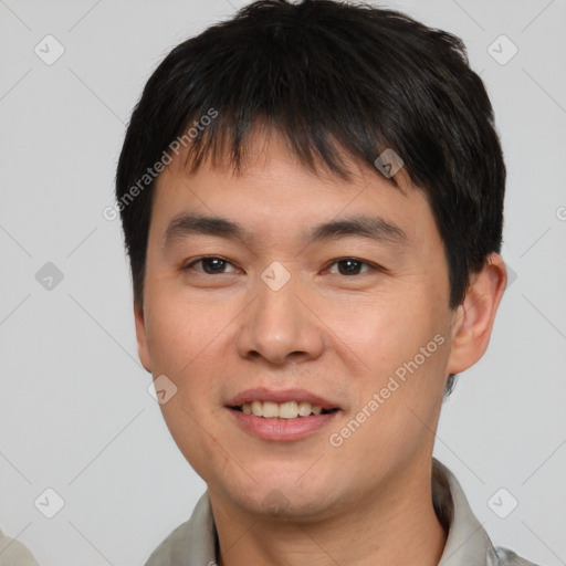 Joyful asian young-adult male with short  brown hair and brown eyes