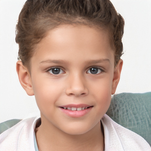 Joyful white child female with short  brown hair and brown eyes