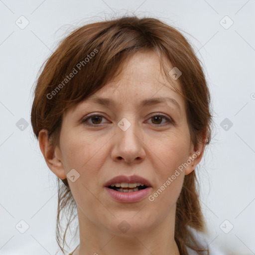 Joyful white adult female with medium  brown hair and brown eyes