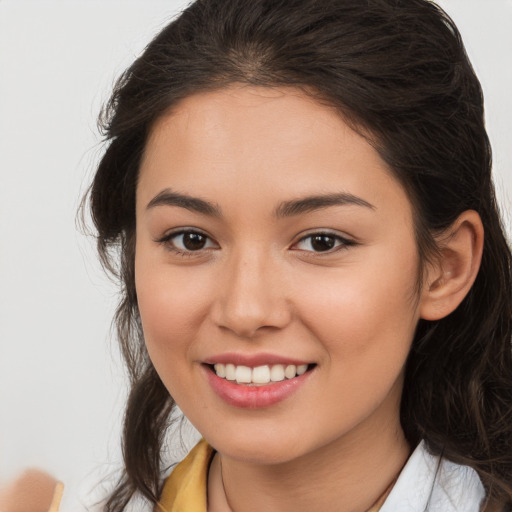 Joyful white young-adult female with long  brown hair and brown eyes