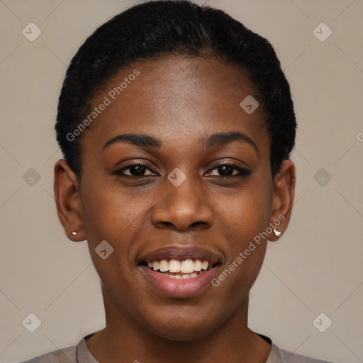 Joyful black young-adult female with short  black hair and brown eyes