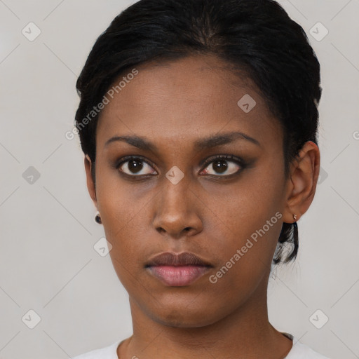 Neutral black young-adult female with short  black hair and brown eyes