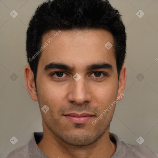 Joyful white young-adult male with short  black hair and brown eyes