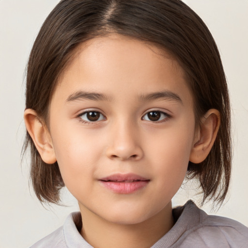 Joyful white child female with medium  brown hair and brown eyes