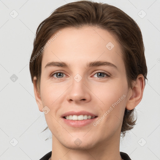 Joyful white young-adult female with short  brown hair and grey eyes