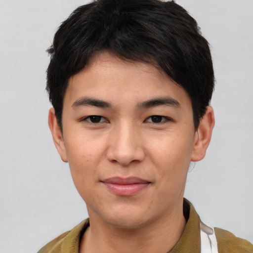 Joyful asian young-adult male with short  brown hair and brown eyes