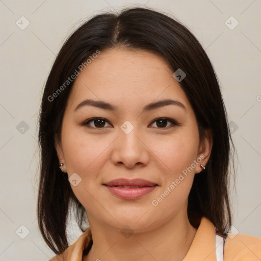 Joyful latino young-adult female with medium  brown hair and brown eyes