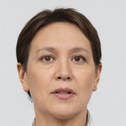 Joyful white adult female with short  brown hair and brown eyes