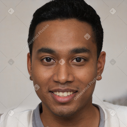 Joyful latino young-adult male with short  black hair and brown eyes