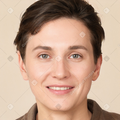 Joyful white young-adult female with short  brown hair and grey eyes