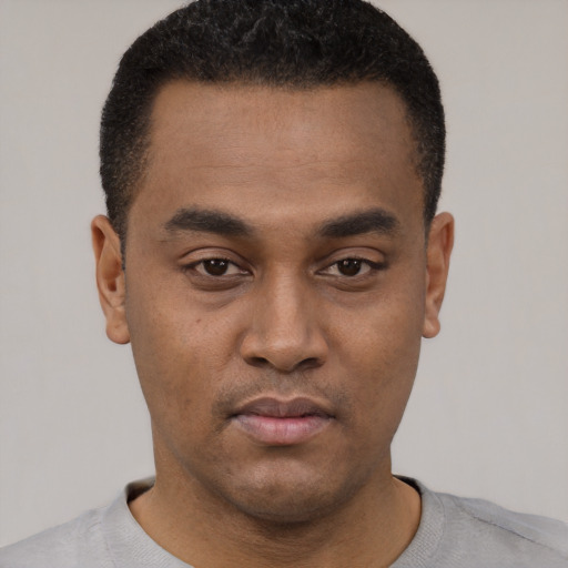 Neutral black young-adult male with short  black hair and brown eyes