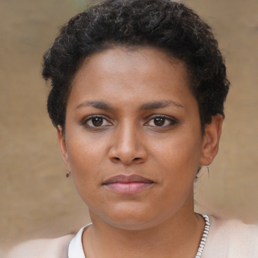 Neutral black young-adult female with short  brown hair and brown eyes