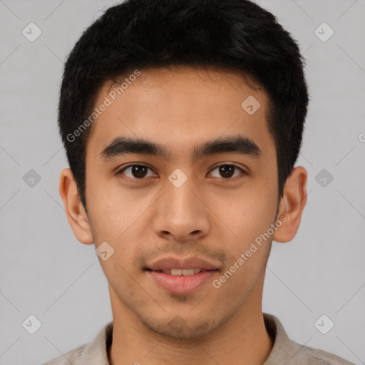 Joyful latino young-adult male with short  brown hair and brown eyes