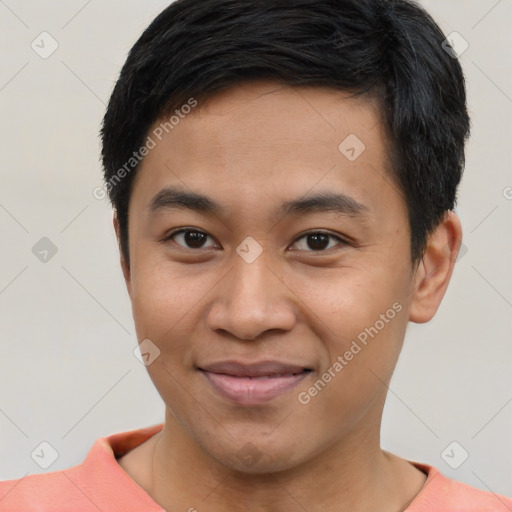 Joyful asian young-adult male with short  black hair and brown eyes