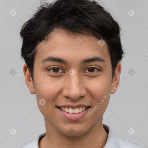 Joyful latino young-adult male with short  brown hair and brown eyes