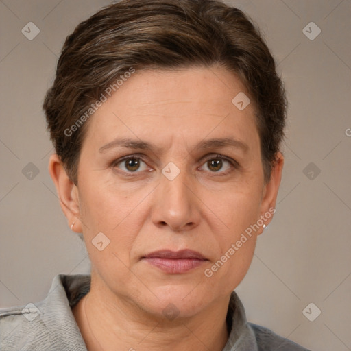 Joyful white adult female with short  brown hair and grey eyes