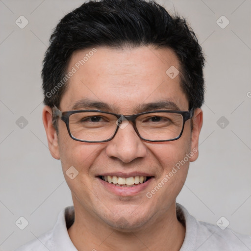 Joyful white adult male with short  black hair and brown eyes