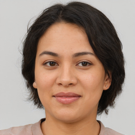 Joyful asian young-adult female with medium  brown hair and brown eyes