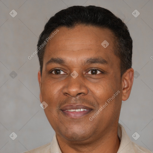Joyful latino adult male with short  black hair and brown eyes