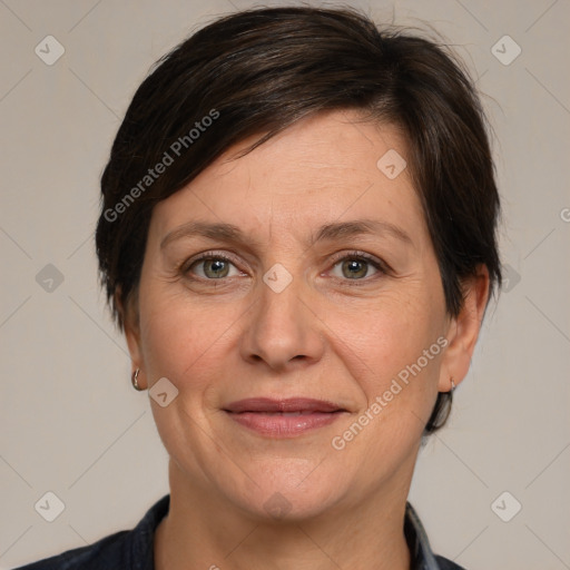 Joyful white adult female with medium  brown hair and brown eyes