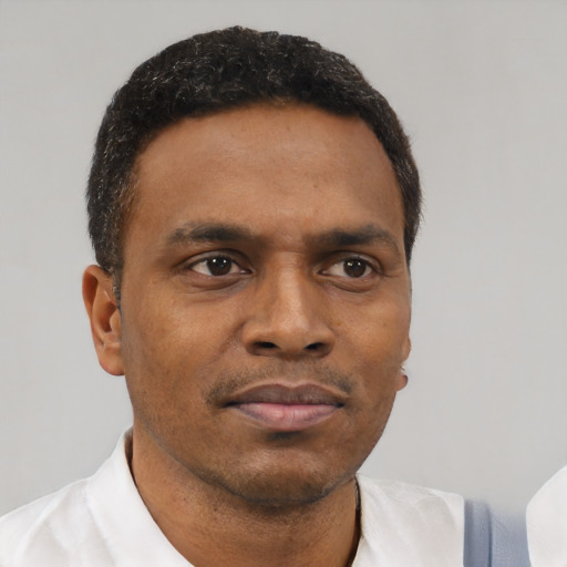 Neutral black young-adult male with short  brown hair and brown eyes