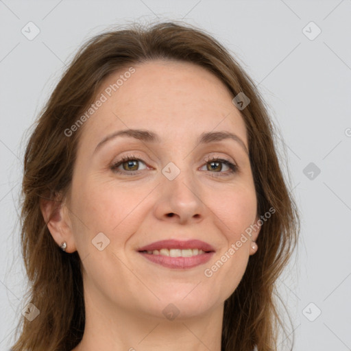 Joyful white adult female with long  brown hair and grey eyes