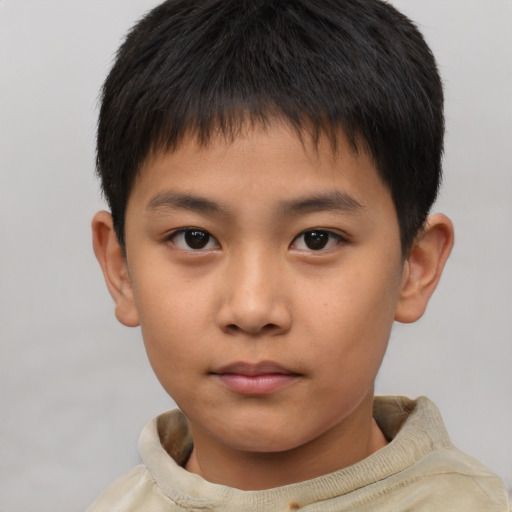 Neutral asian child male with short  brown hair and brown eyes