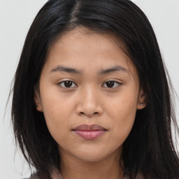 Joyful asian young-adult female with long  brown hair and brown eyes