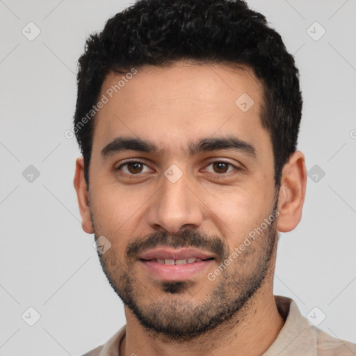 Joyful latino young-adult male with short  black hair and brown eyes