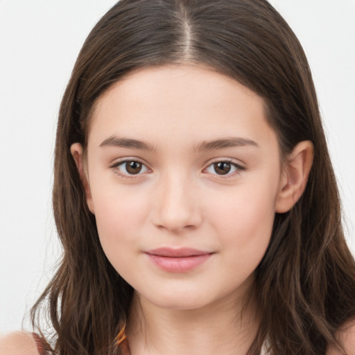 Joyful white child female with long  brown hair and brown eyes